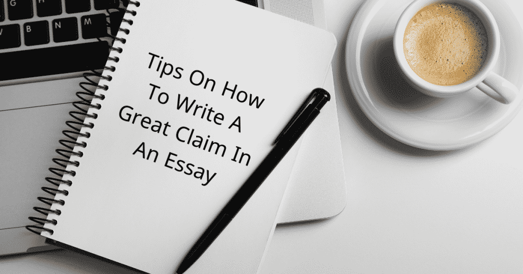 A book, a pen and cup of tea on a table - What is a claim in an essay